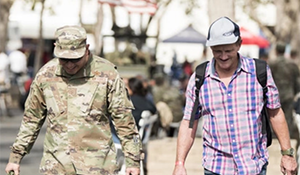 Photo of two people walking together