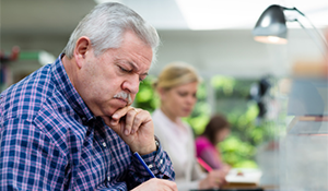 Person watching training content on a laptop