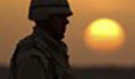 Soldier in setting sun