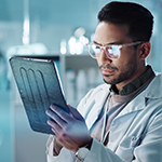Scientist looking at a tablet